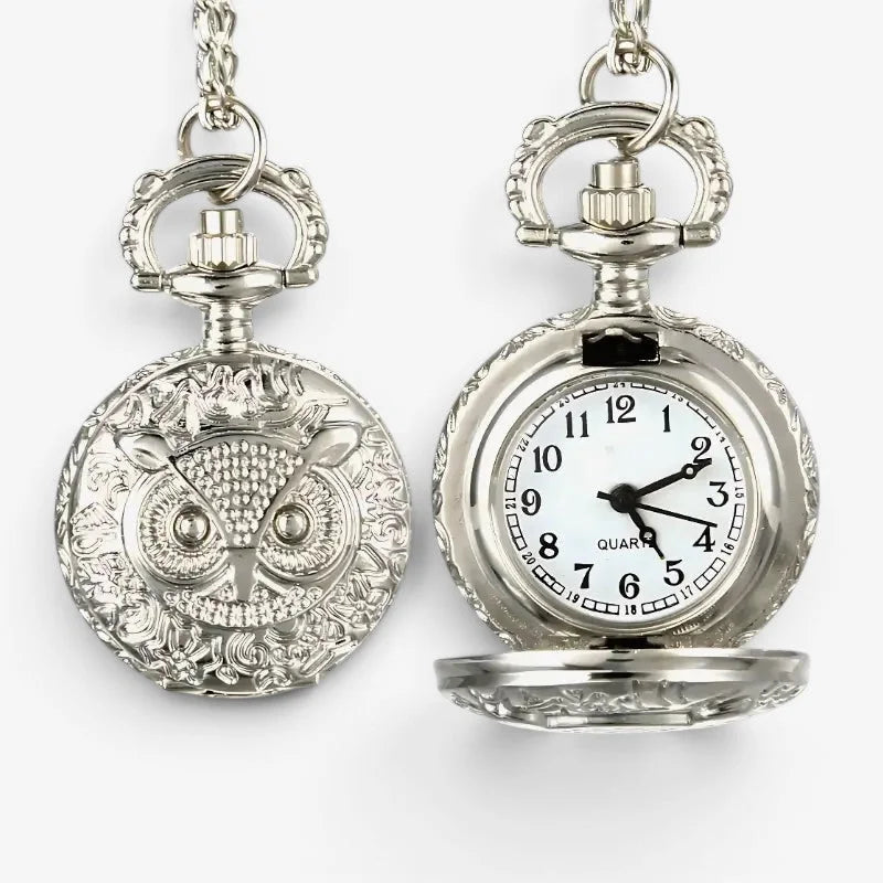 Silver owl pocket watch with ornate detailing and a white face made of silver metal for elegant timekeeping