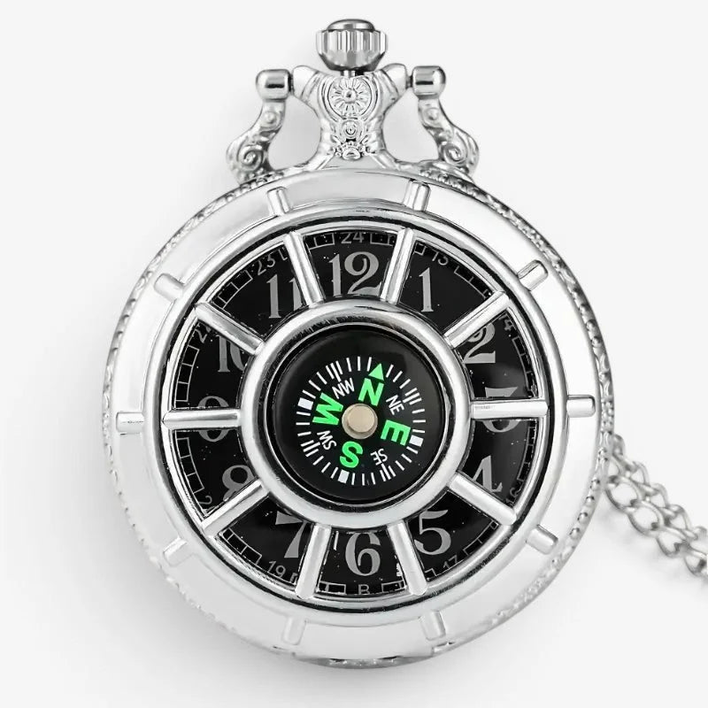 Silver pocket watch and compass with a silver tone, black face, hour markers, and integrated green-lit compass center