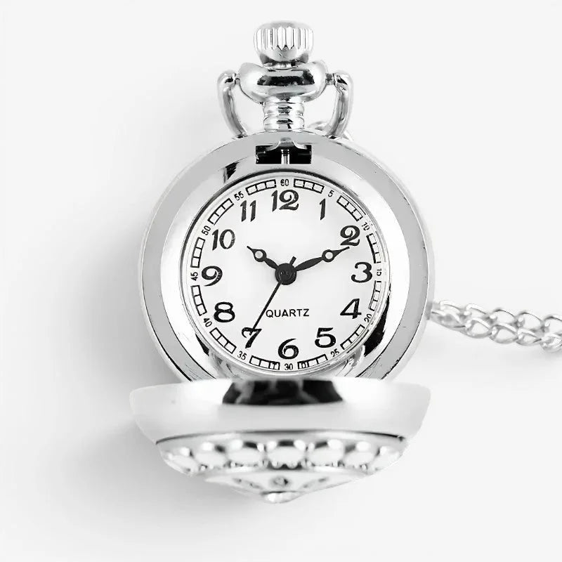 Silver pocket watch necklace with a silver-toned ornate case and white dial featuring black numerals and hands