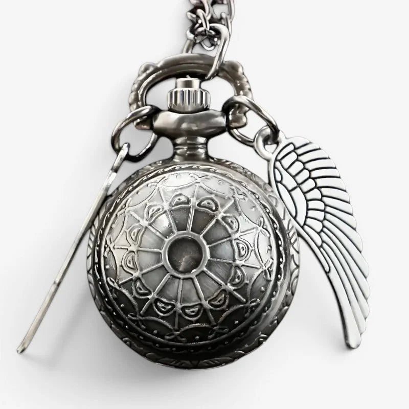 Silver snitch pocket watch antique silver-toned with intricate floral engravings attached to chain and angel wing charm
