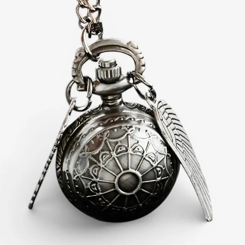 Silver snitch pocket watch antique silver-toned with intricate engravings and a wing charm on its chain