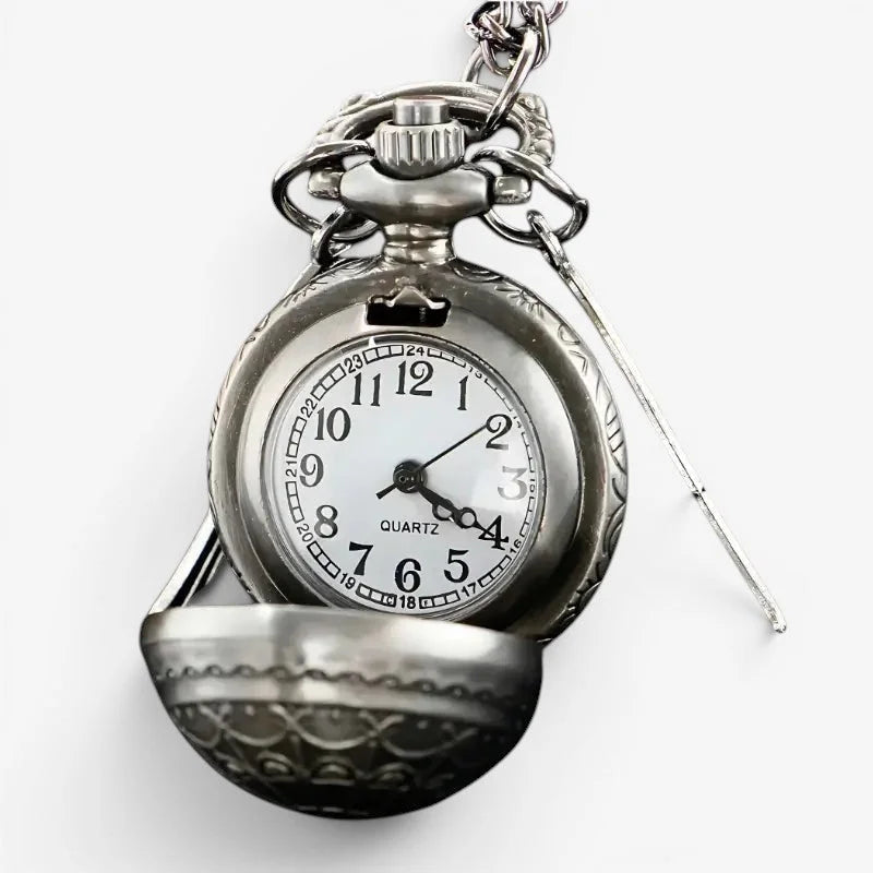 Silver snitch pocket watch with a silver-toned ornate engraved case and a white face with black numerals and hands