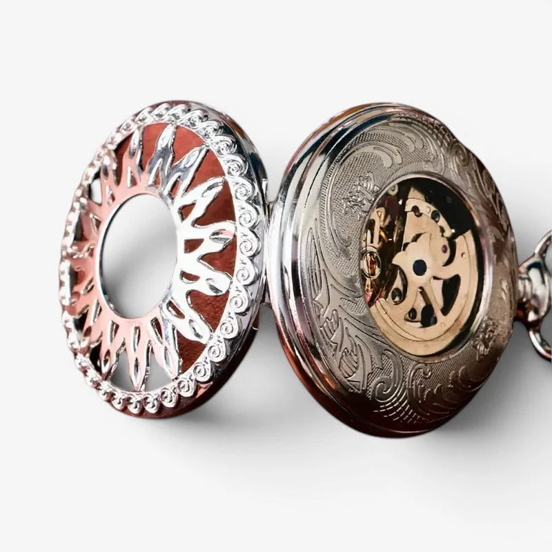 Silver sun pocket watch ornate silver pocket watch with intricate engravings and visible golden gear mechanism inside