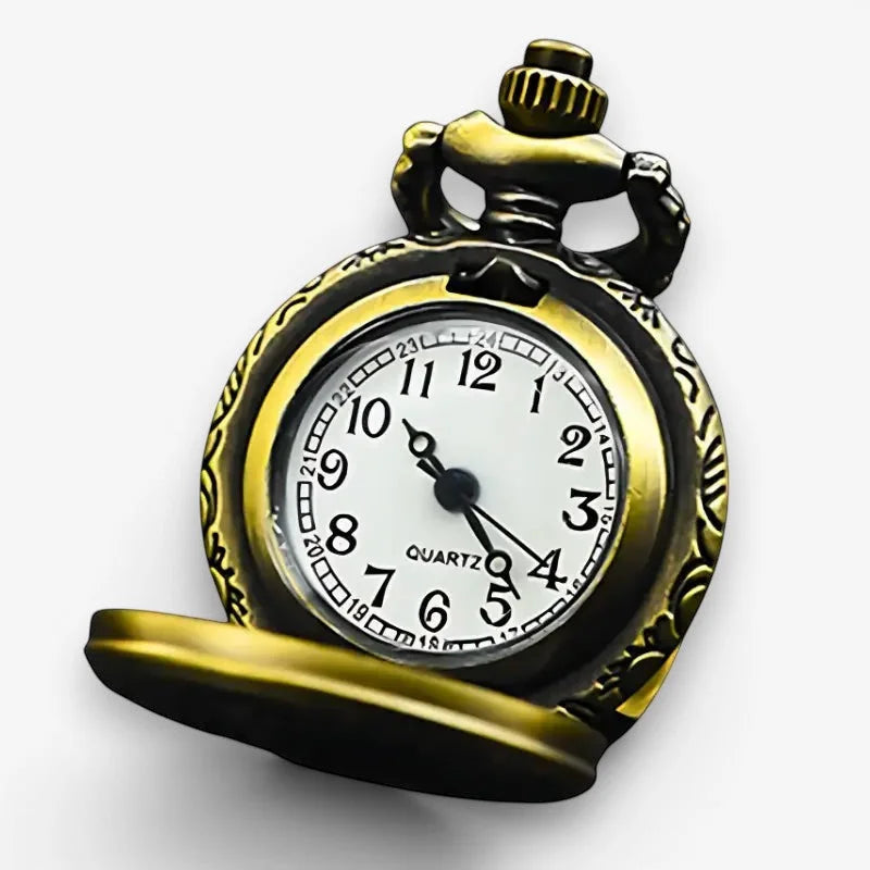 Small pocket watch antique-style brass with white face black numerals and ornate engraved casing details