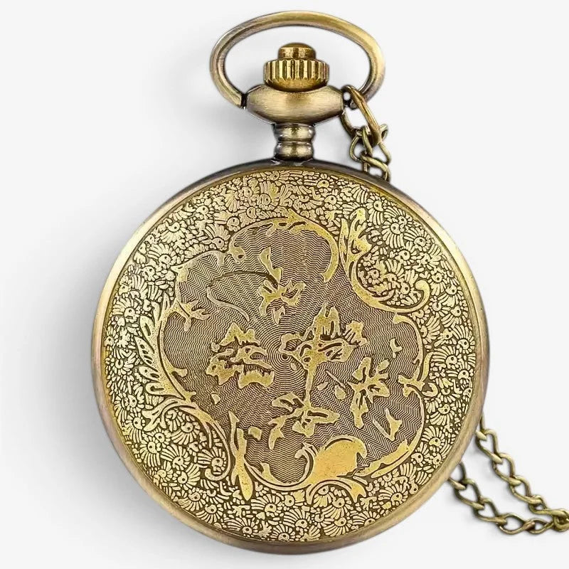 Antique brass soccer ball pocket watch with intricate floral and scrollwork engraving and matching chain