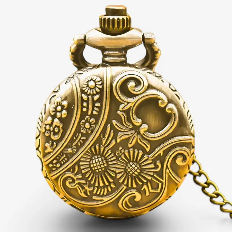 Golden spider web pocket watch with intricate floral scrollwork engravings brass finish and attached chain