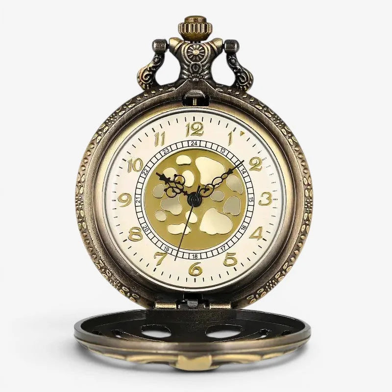 Antique-style spine pocket watch with cream face gold hands and numerals and ornate engraved brass case