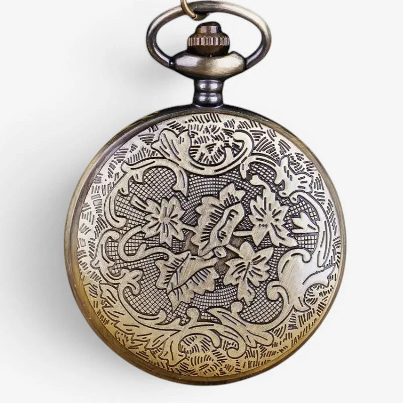 Antique-style brass pocket watch with intricate floral engravings and vintage metal clasp in stainless steel design