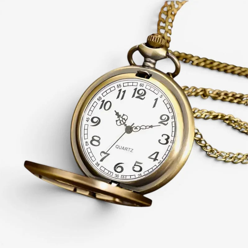 Antique brass star wars pocket watch with white face black arabic numerals and matching gold-toned chain