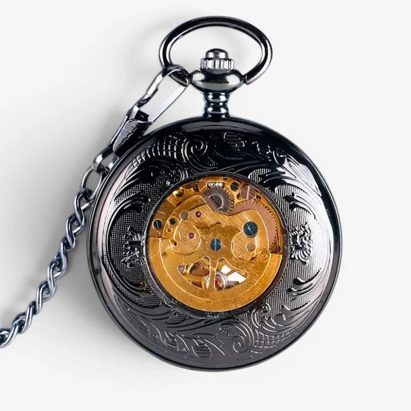 Steampunk skeleton pocket watch with black ornate casing and visible golden mechanical movement and intricate engravings