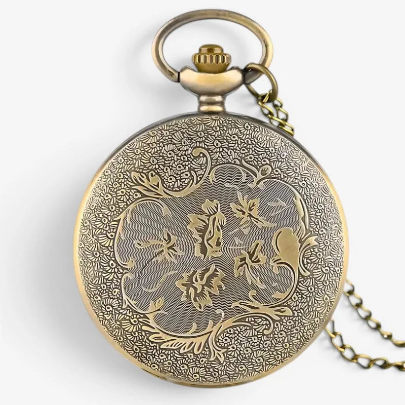 Antique brass stitch pocket watch with intricate floral engravings and delicate chain for elegant timekeeping