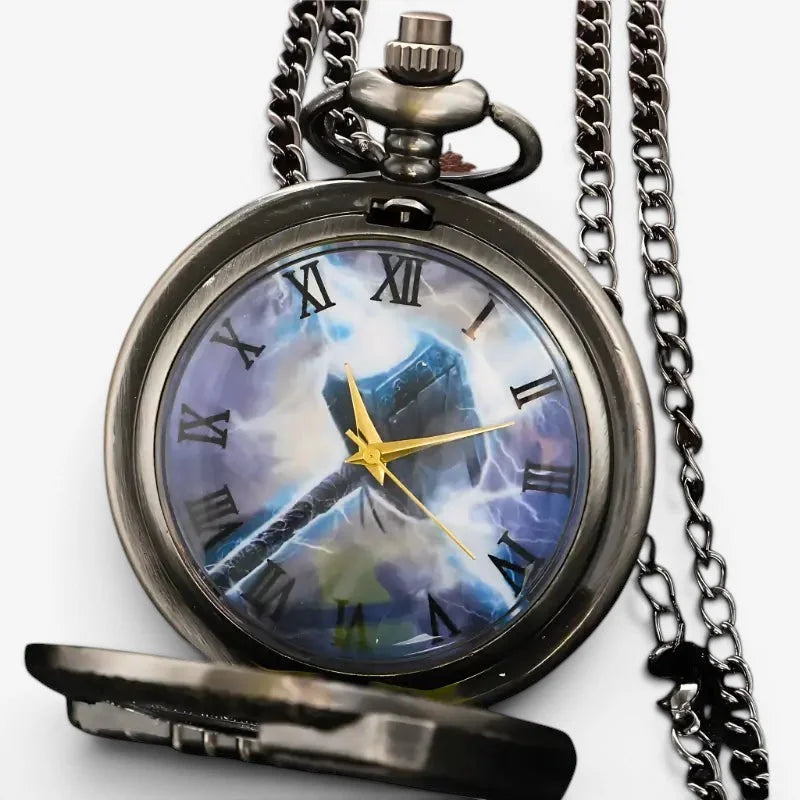 Antique silver-toned thor pocket watch with vibrant blue and white thor’s hammer design and gold hands