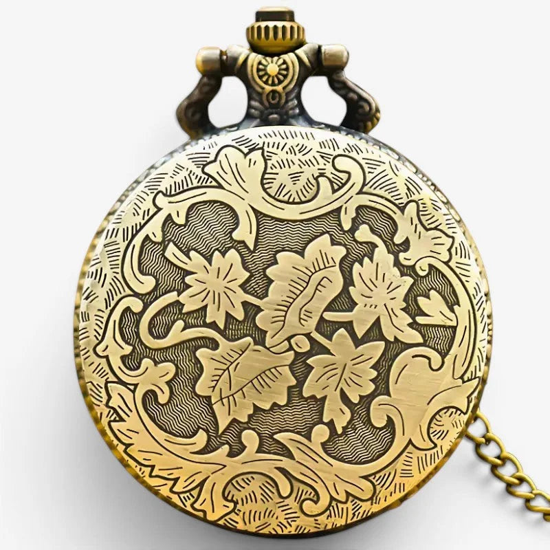 Antique-style brass thundercats pocket watch with intricate floral engravings and decorative crown detail