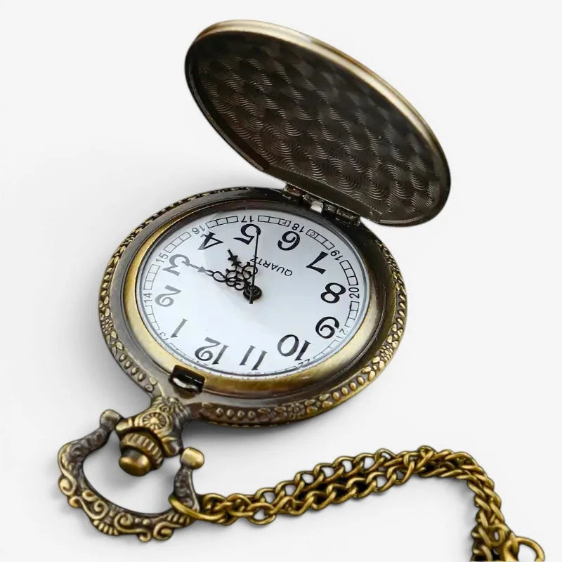 Antique brass-finished Titanic pocket watch with white face, black arabic numerals, and ornate chain