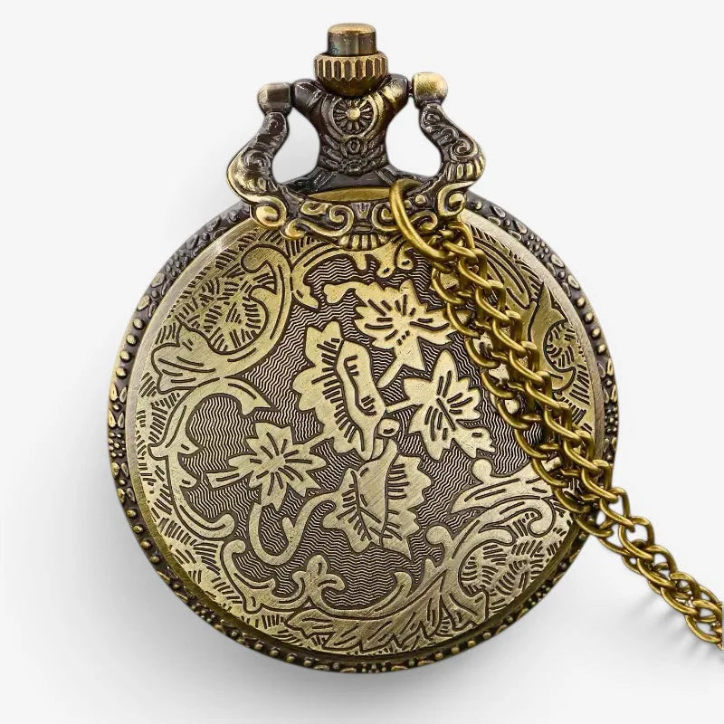 Antique brass Titanic pocket watch with intricate floral engravings and matching chain displayed from the front side