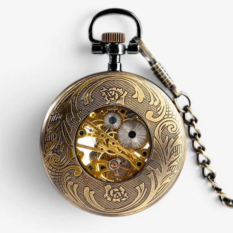 Antique brass tommy shelby pocket watch with intricate floral engravings and visible mechanical movement and black chain