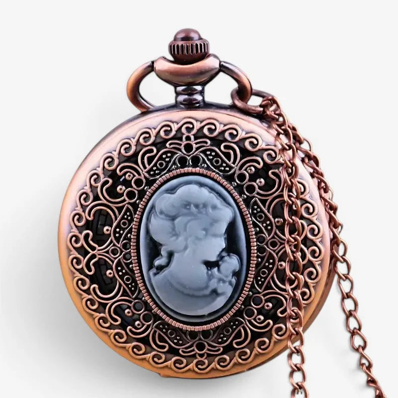 Antique bronze-colored women’s necklace watch with intricate scrollwork and dark gray cameo portrait centerpiece