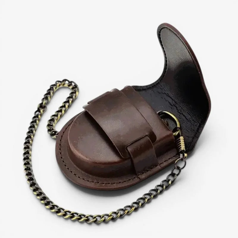 Vintage brown pocket watch case made of leather with a brass-toned clasp and attached chain for secure carrying