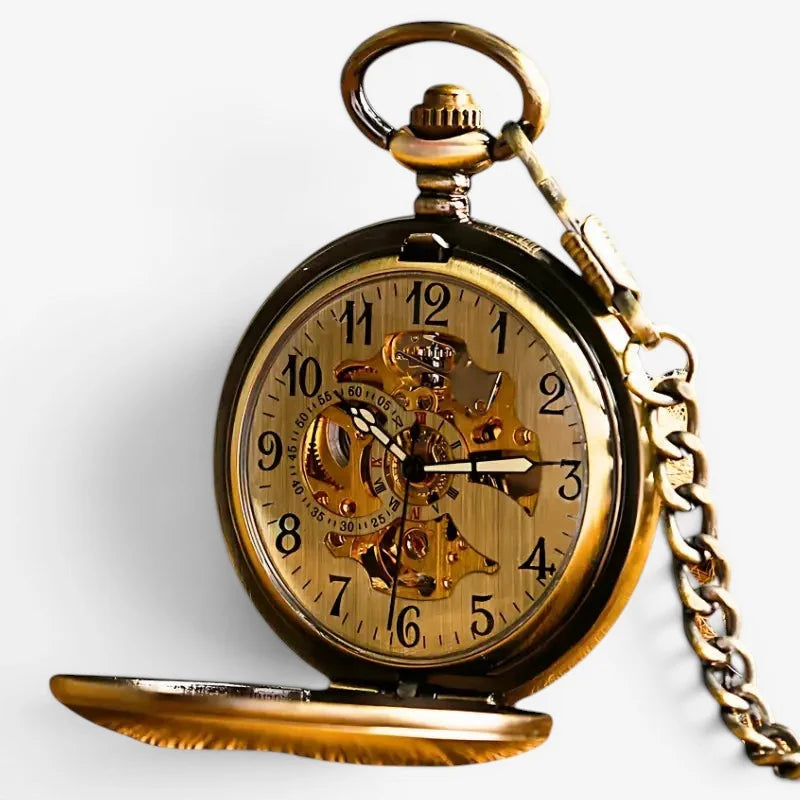 Vintage mechanical pocket watch in antique gold tone with exposed mechanical gears and matching chain