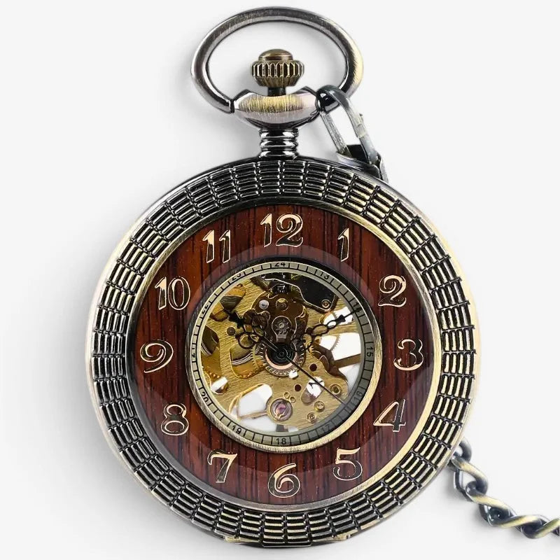 Vintage mechanical wood pocket watch with dark wood-grain face, brass and silver casing, arabic numerals, and exposed gears