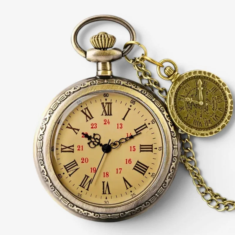 Vintage quartz pocket watch in antique brass finish with ornate engraved casing and cream dial with roman numerals