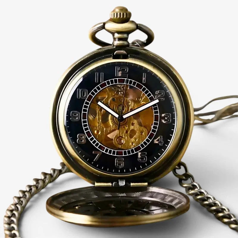 Antique brass western pocket watch with black face exposed golden gears and attached chain for vintage style use