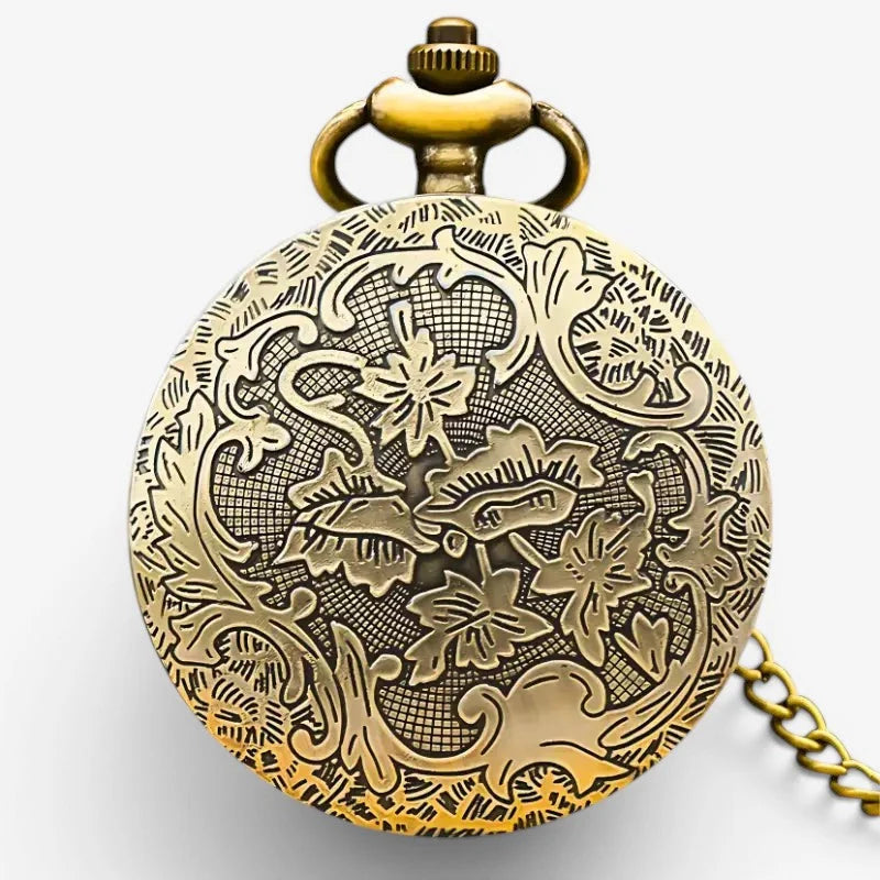 Antique brass womens butterfly pocket watch with intricate floral engravings and matching chain