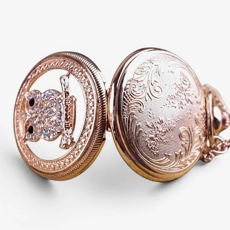 Rose gold womens owl pendant watch with crystal encrusted owl and rifle design and floral engraving on the back side