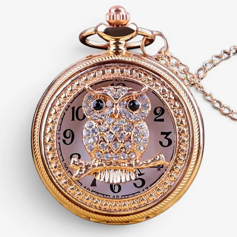 Rose gold womens owl pendant watch with crystal-encrusted design and matching chain pocket watch