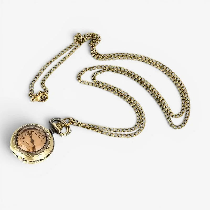 Antique brass-finished womens pocket style watch with ornate detailing rose gold dial and adjustable chain suspension
