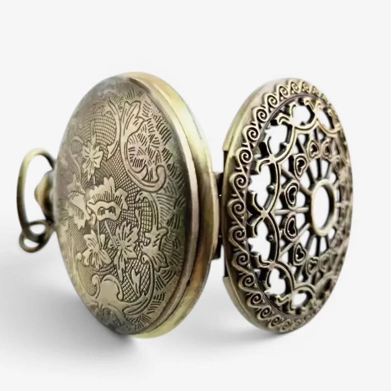 Womens steampunk pocket watch in antique brass with intricate floral engraving and ornate openwork heart design back side