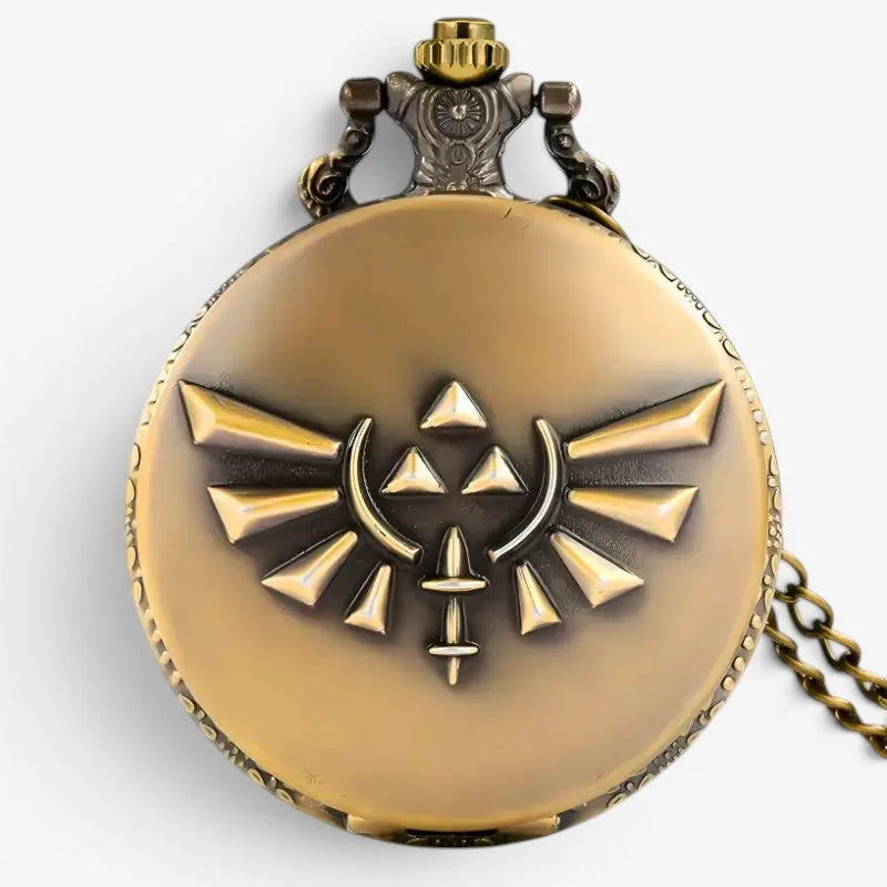 Antique gold-colored Zelda pocket watch with raised triforce emblem ornate detailing and matching chain