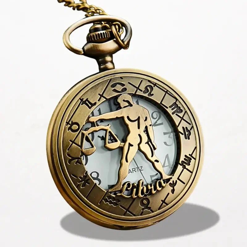 Antique brass zodiac pocket watch necklace with detailed libra scales and engraved astrological signs around dial