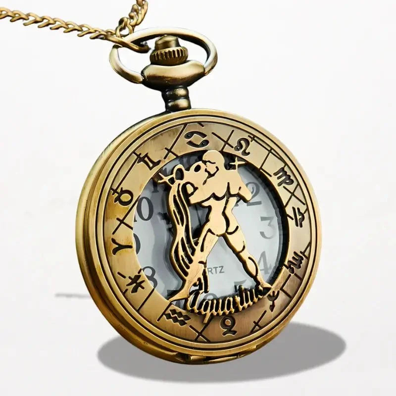 Antique gold-toned zodiac pocket watch with aquarius symbol and engraved astrological designs on circular face
