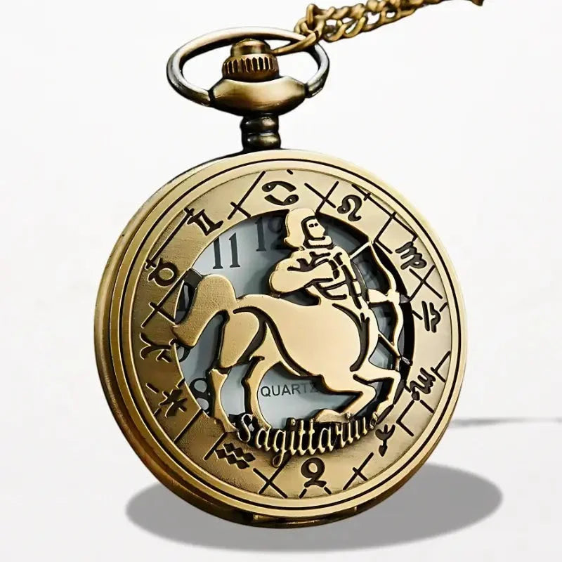 Antique gold-toned zodiac pocket watch featuring a detailed sagittarius design and engraved astrological symbols