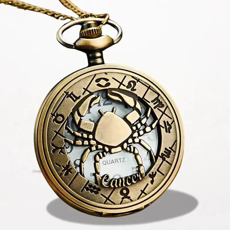 Gold-toned zodiac pocket watch pendant with detailed crab design and cancer engraving on front face
